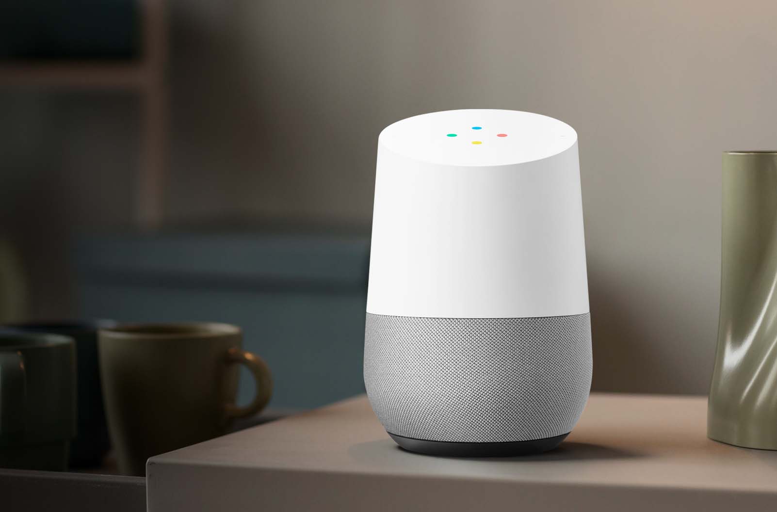 Google Home smart speaker on a table with a blurred background